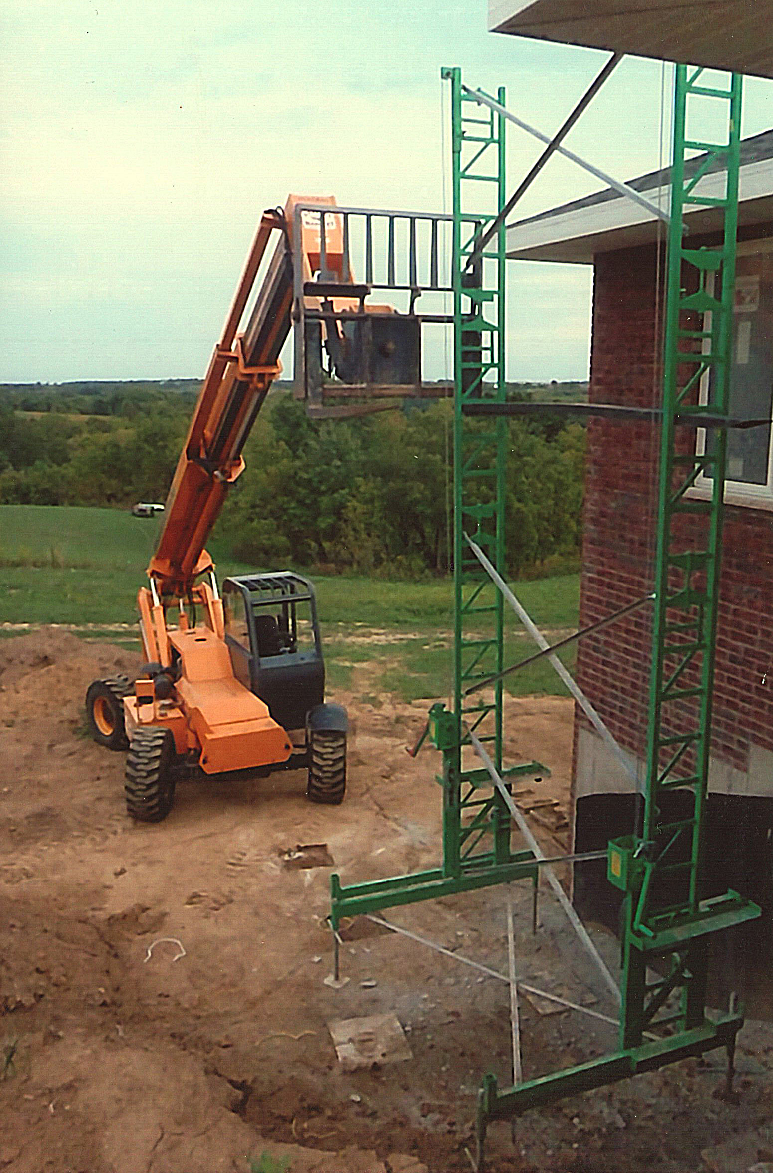 Long fork lifting from side of scaffold